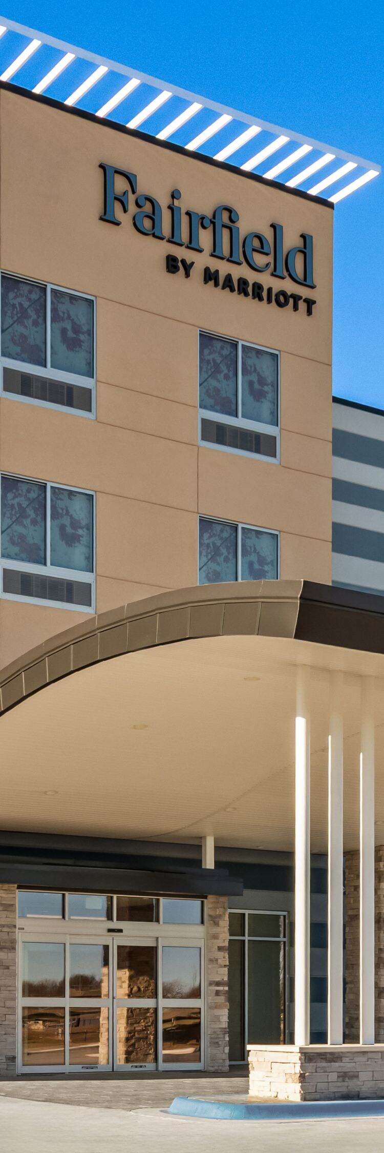 exterior of hotel with clear blue sky