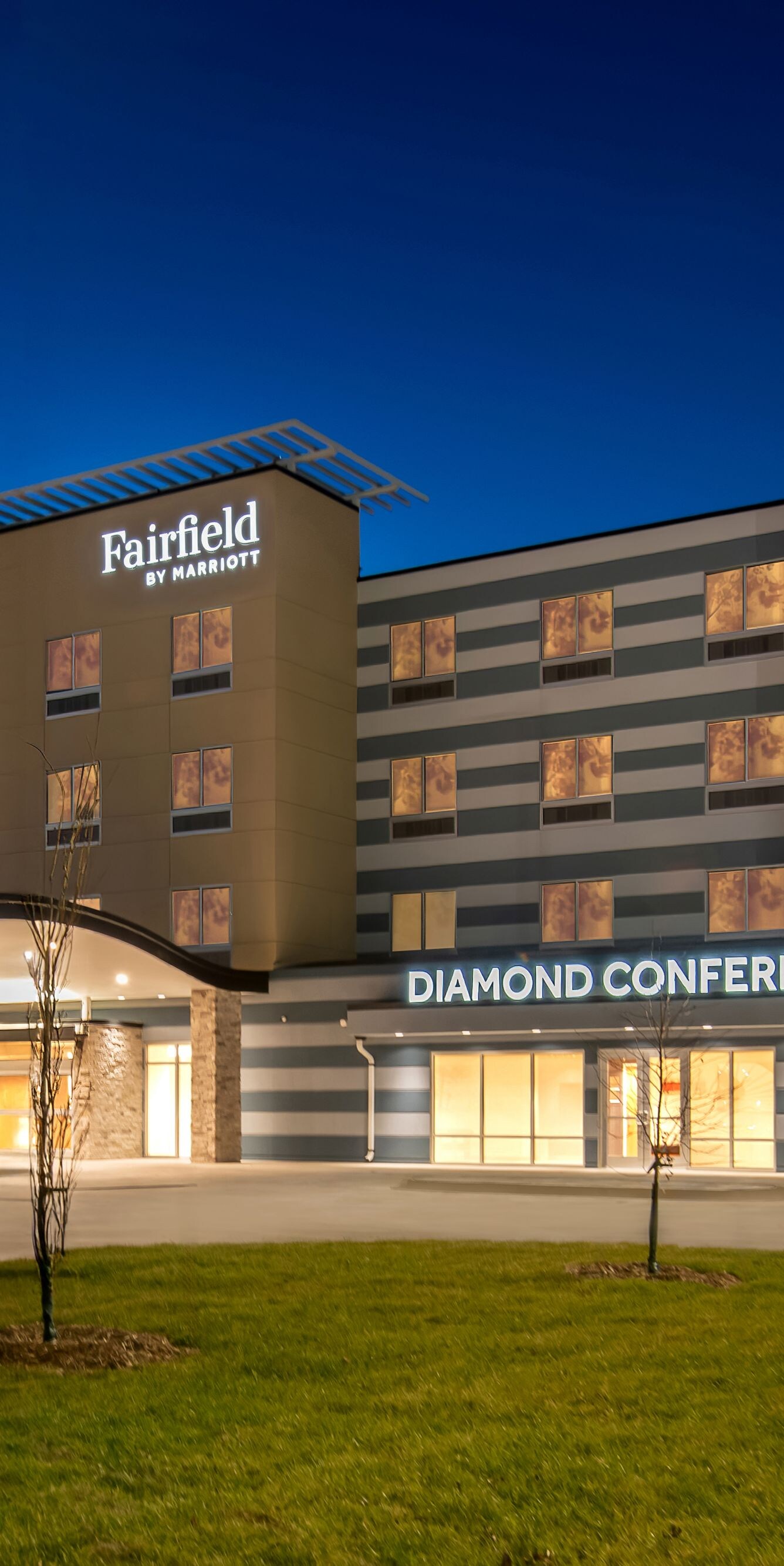 exterior of hotel lit up at night