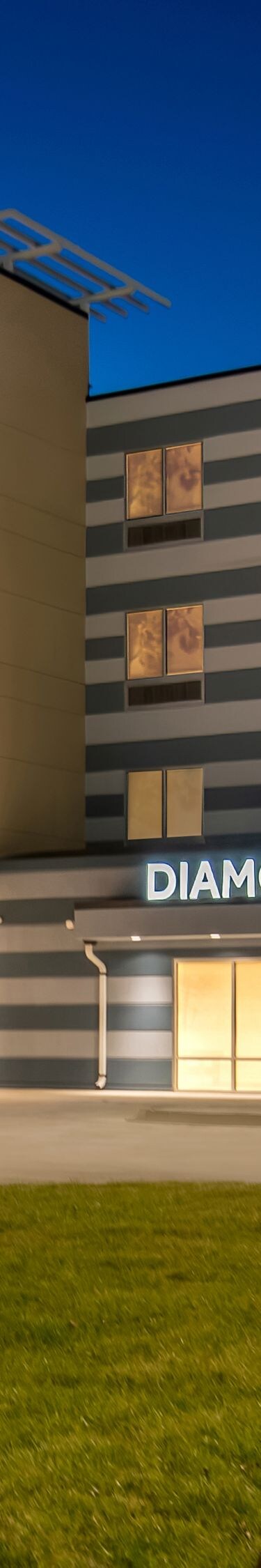 exterior of hotel lit up at night