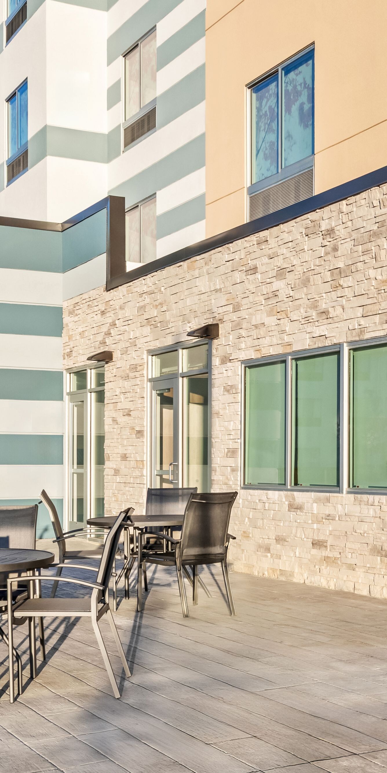 tables and chairs on sunny outdoor patio