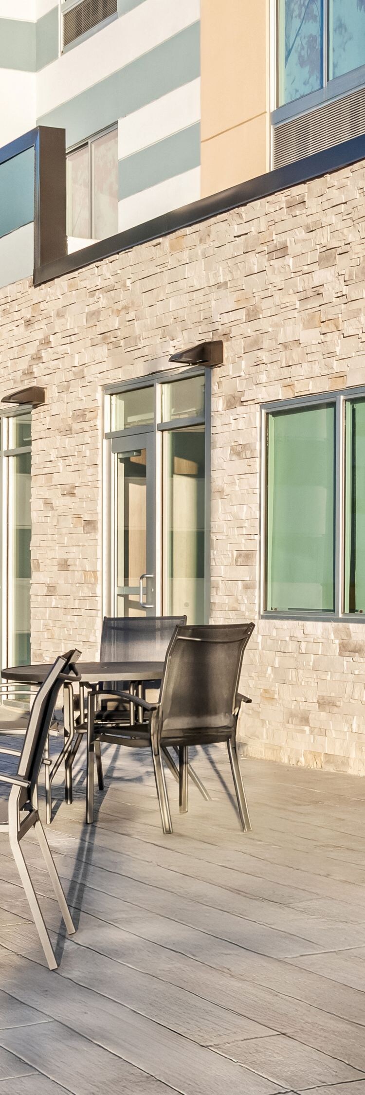tables and chairs on sunny outdoor patio