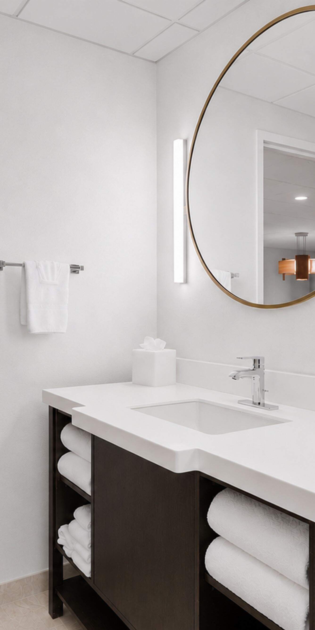 Bathroom vanity with sink and round mirror