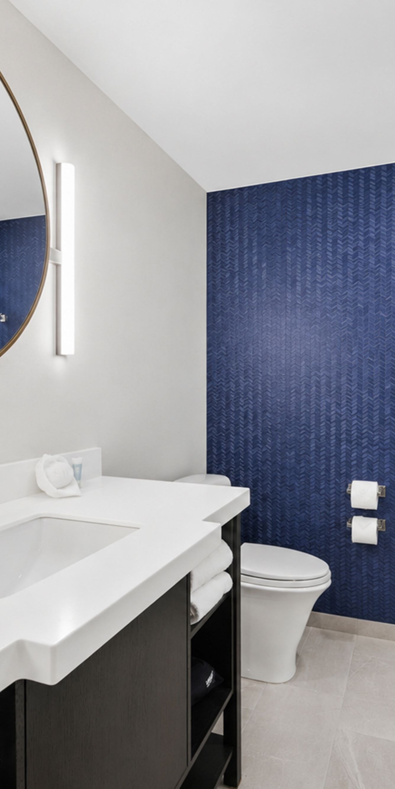 Bathroom with vanity, toilet, and glass shower