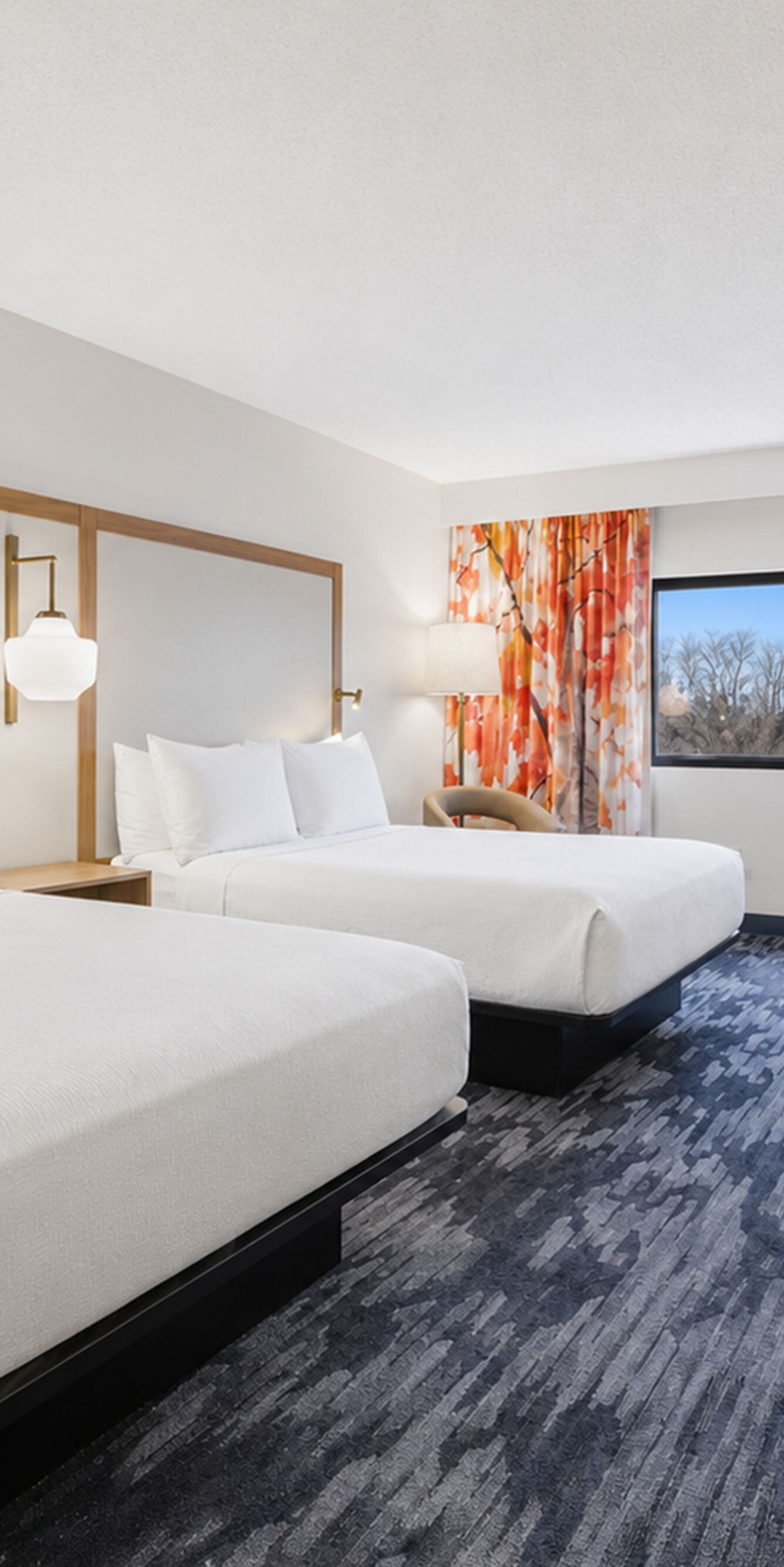 2 queen beds room with desk and window