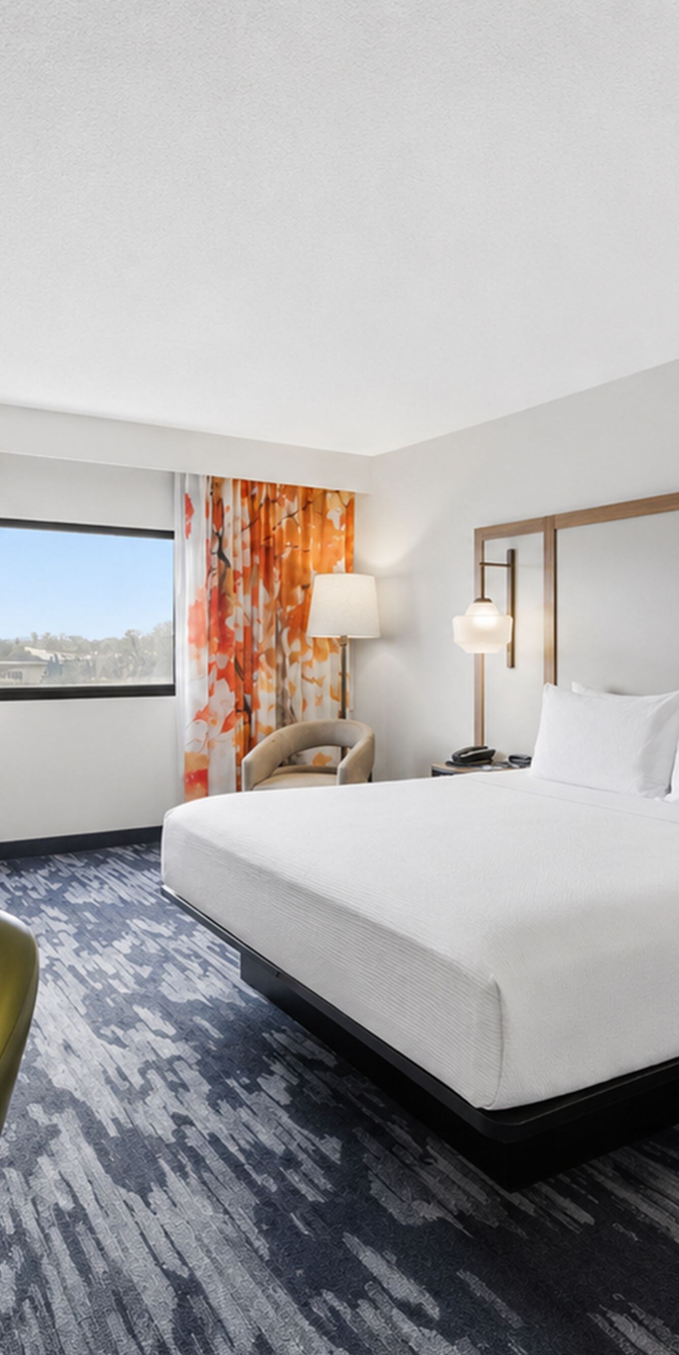 King room with desk, chair, and window view