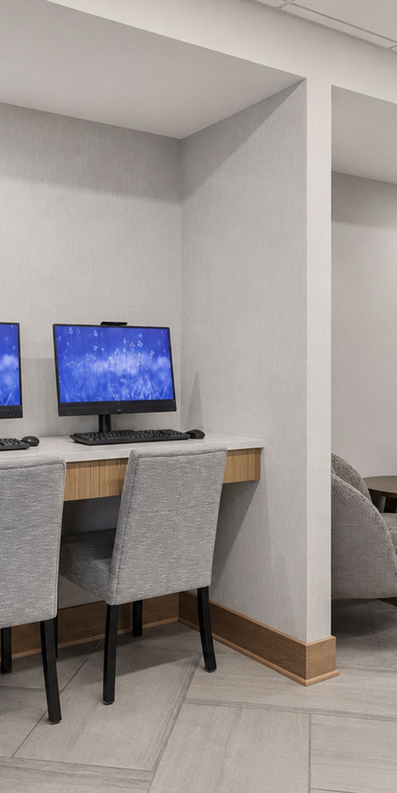 Business centre with computers and lounge seating