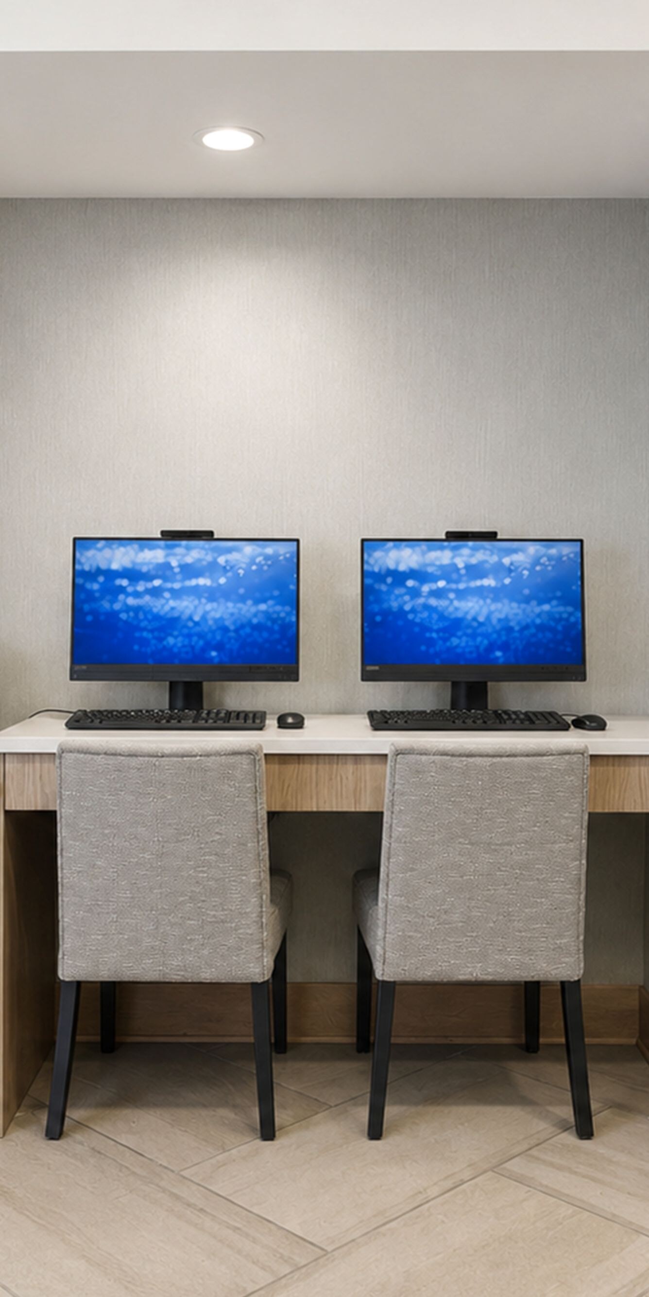 Business centre with computers and lounge seating