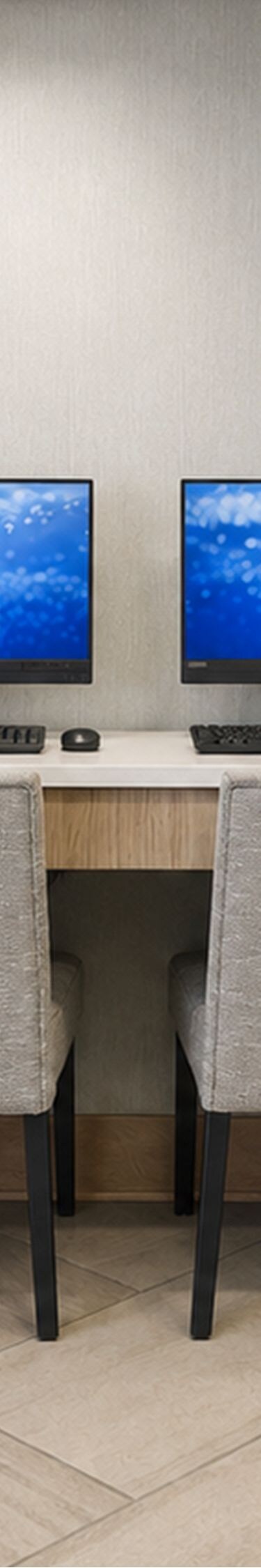 Business centre with computers and lounge seating