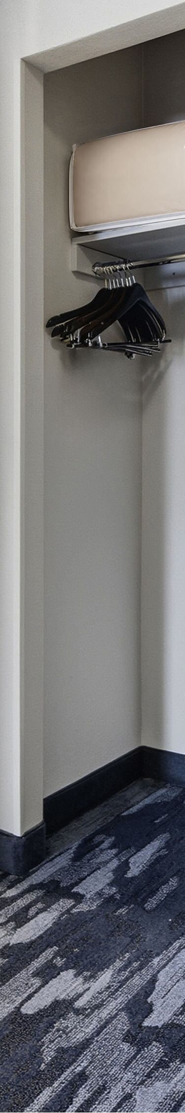 Entryway with closet area and bathroom vanity