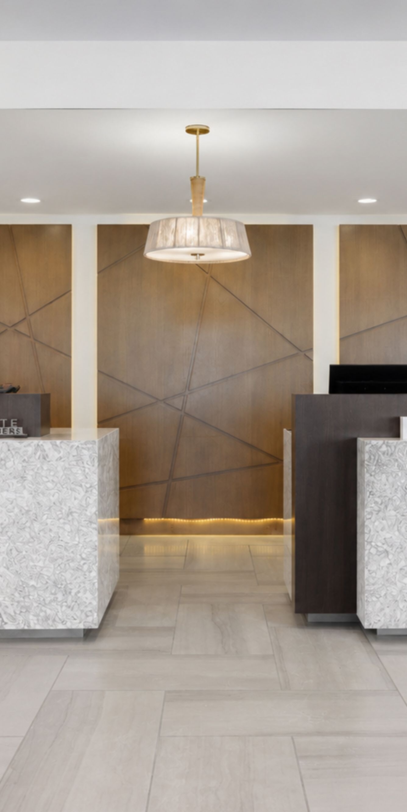 Hotel front desk with multiple check-in stations