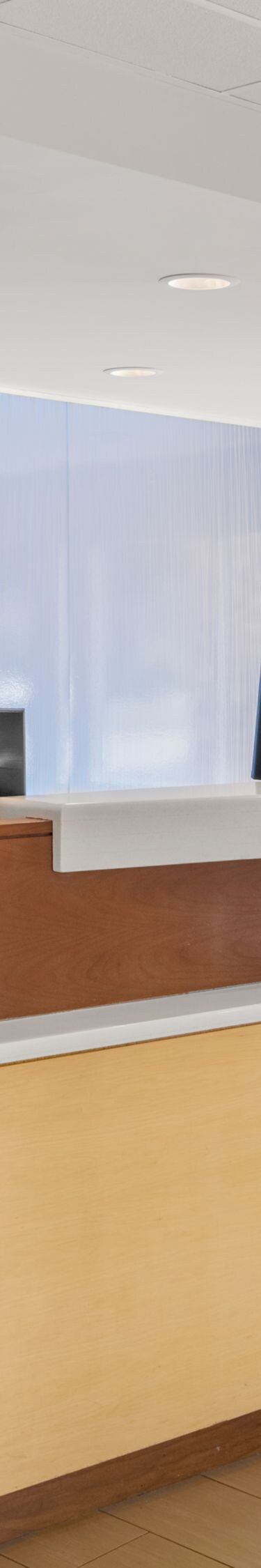 front desk with reception counters and windows