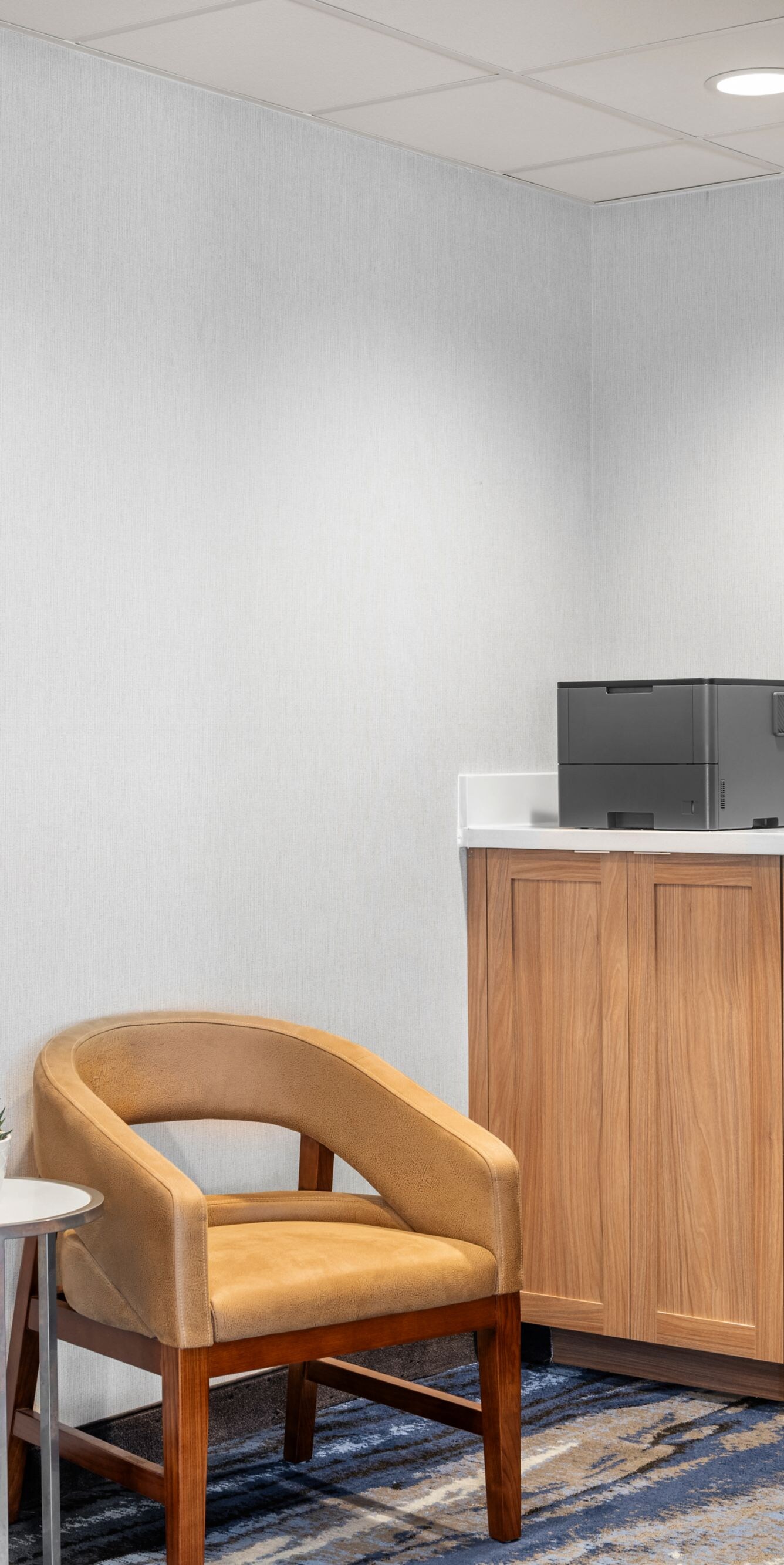 Business center with computer and guest seating