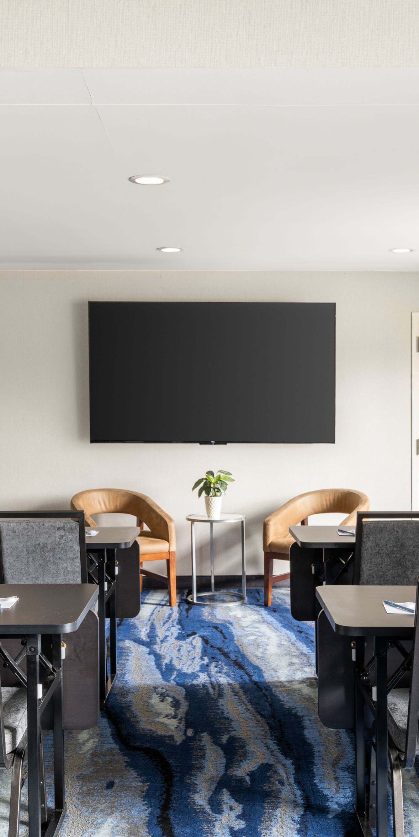 Meeting room with classroom-style seating and TV 
