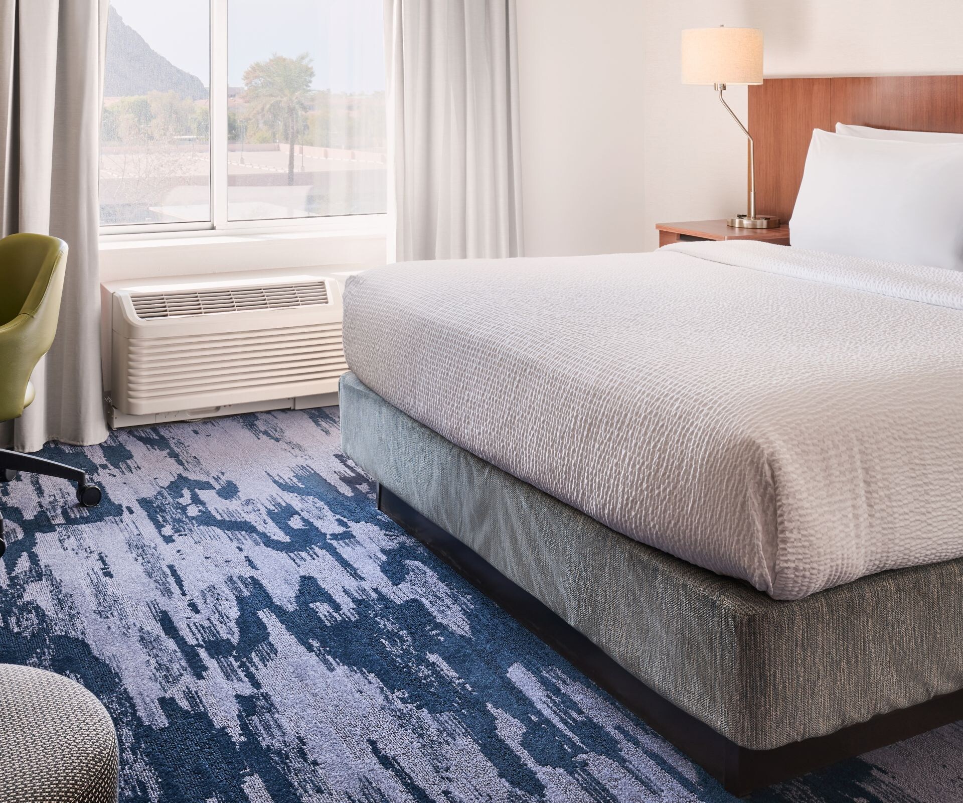 King guest room with desk and window view