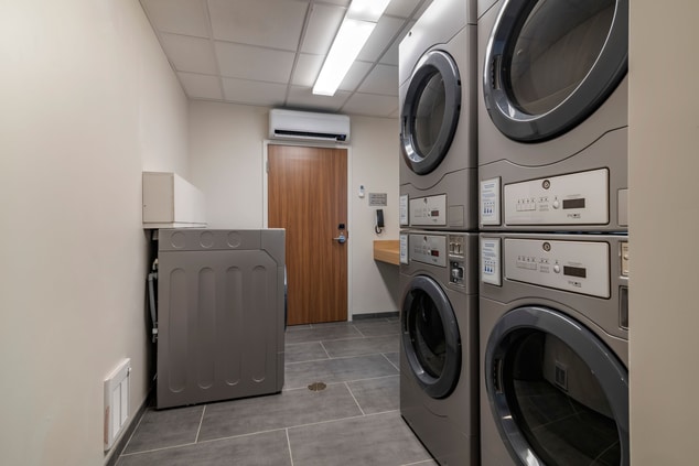 laundry room with washers and dryers