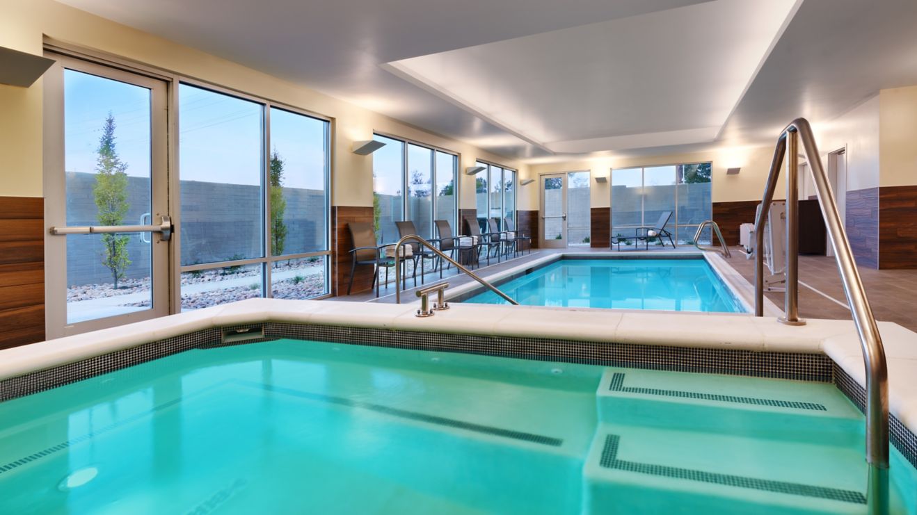 hotel indoor hot tub with pool in background