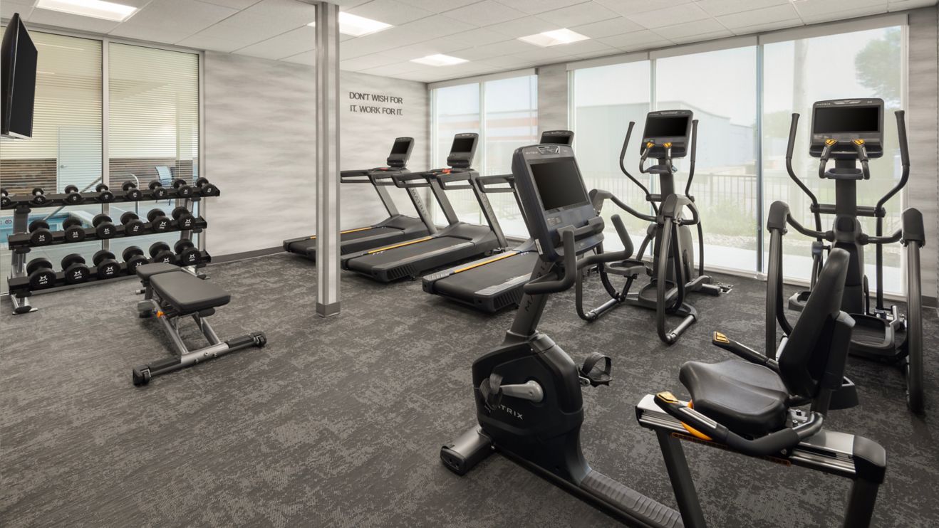 fitness room, free weights, biks, treadmill