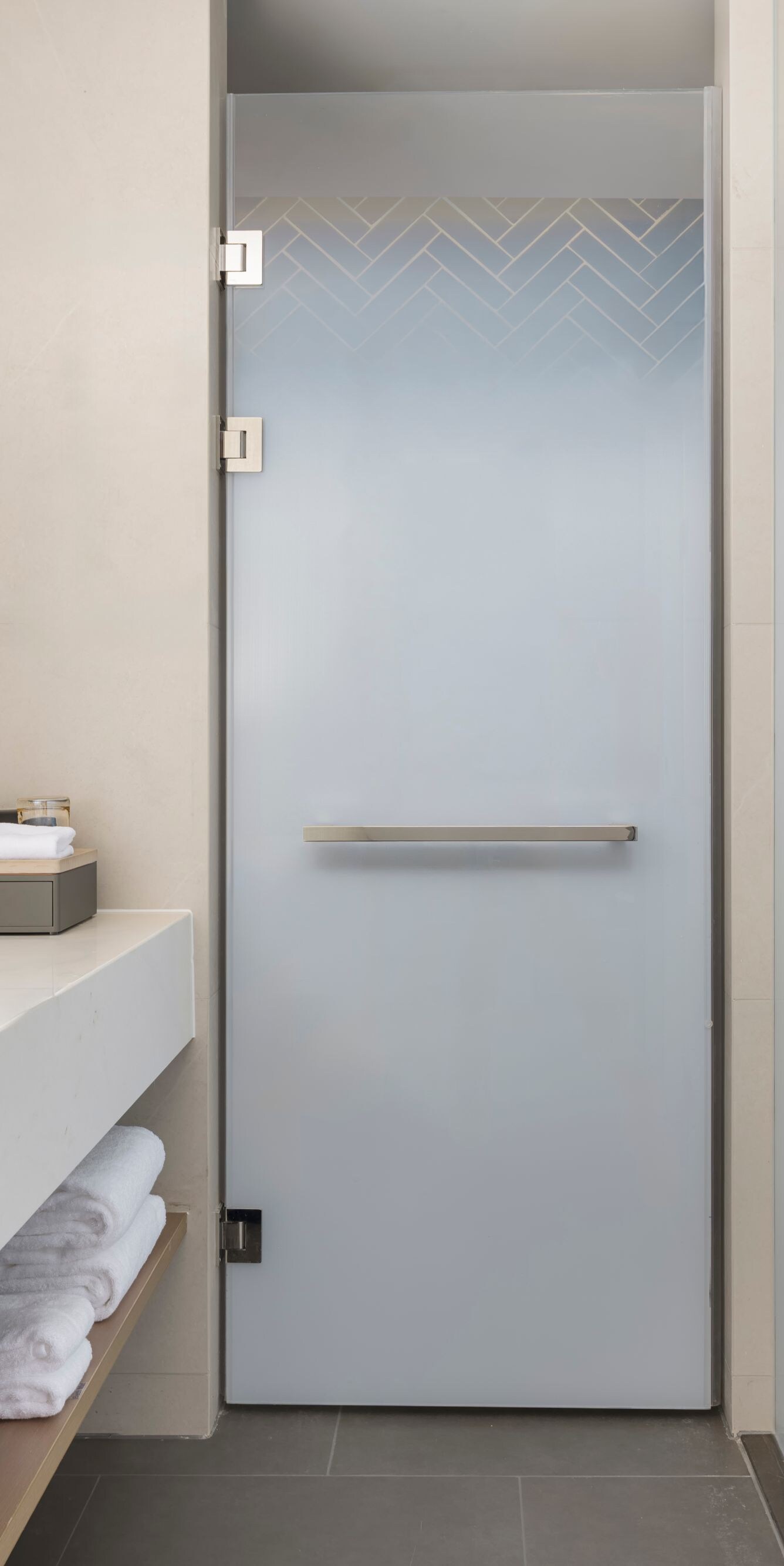 Modern bathroom with vanity and glass door