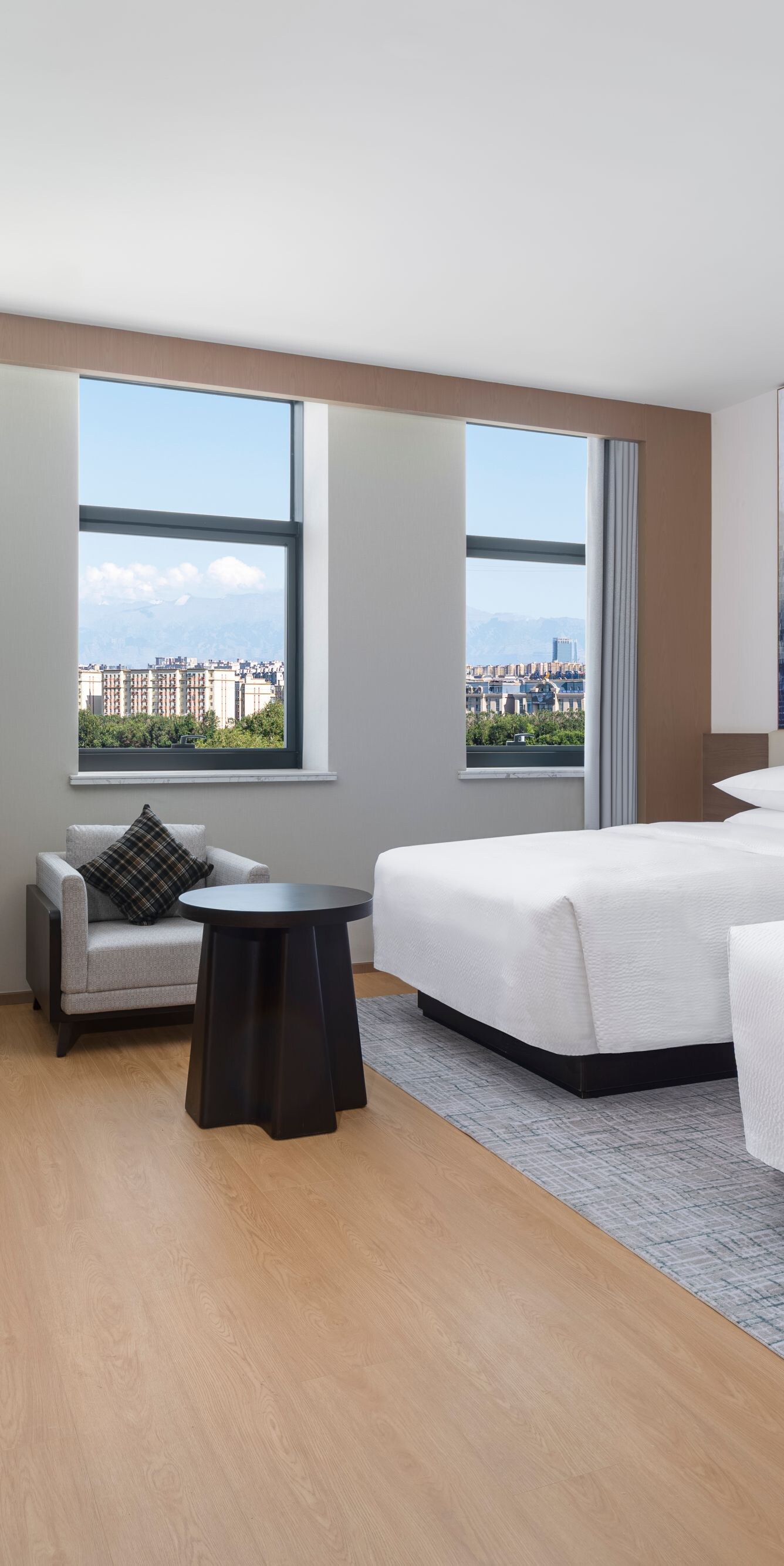 Spacious two queen bed guest room with city view a