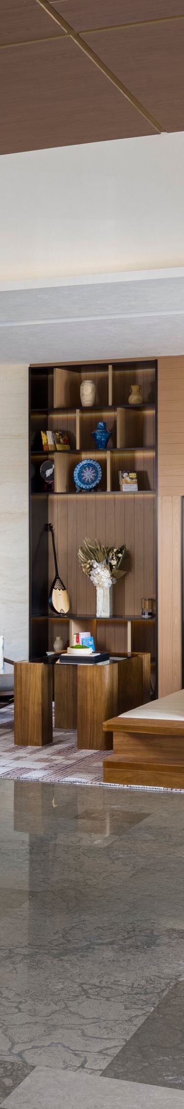 Spacious modern hotel lobby with seating and woode