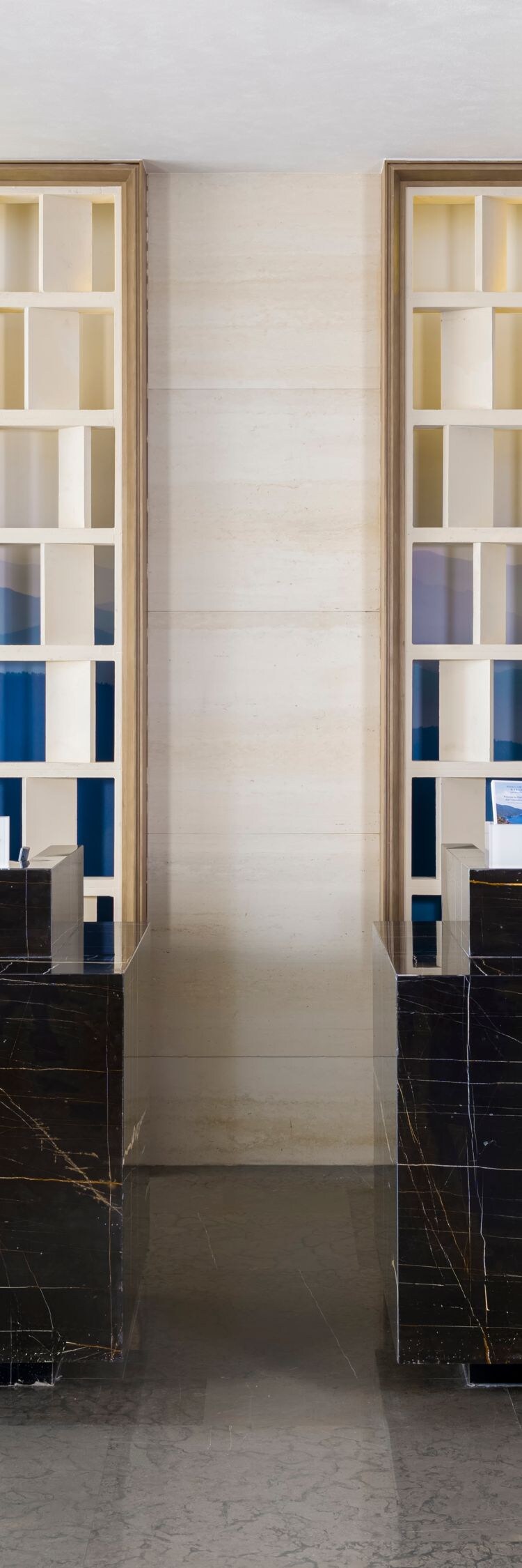 Modern hotel reception counter with decorative scr