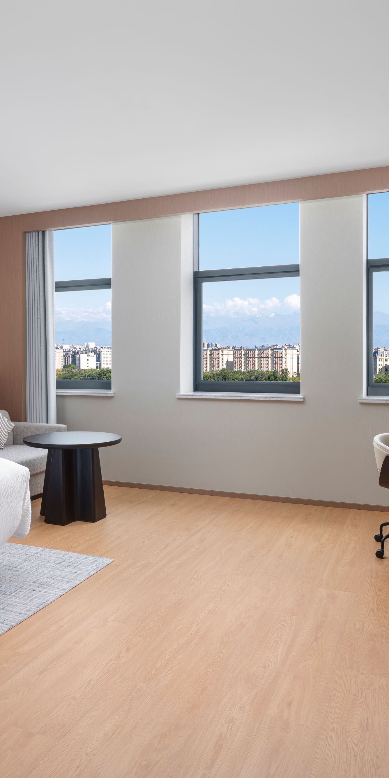 Spacious king bedroom with work desk and view