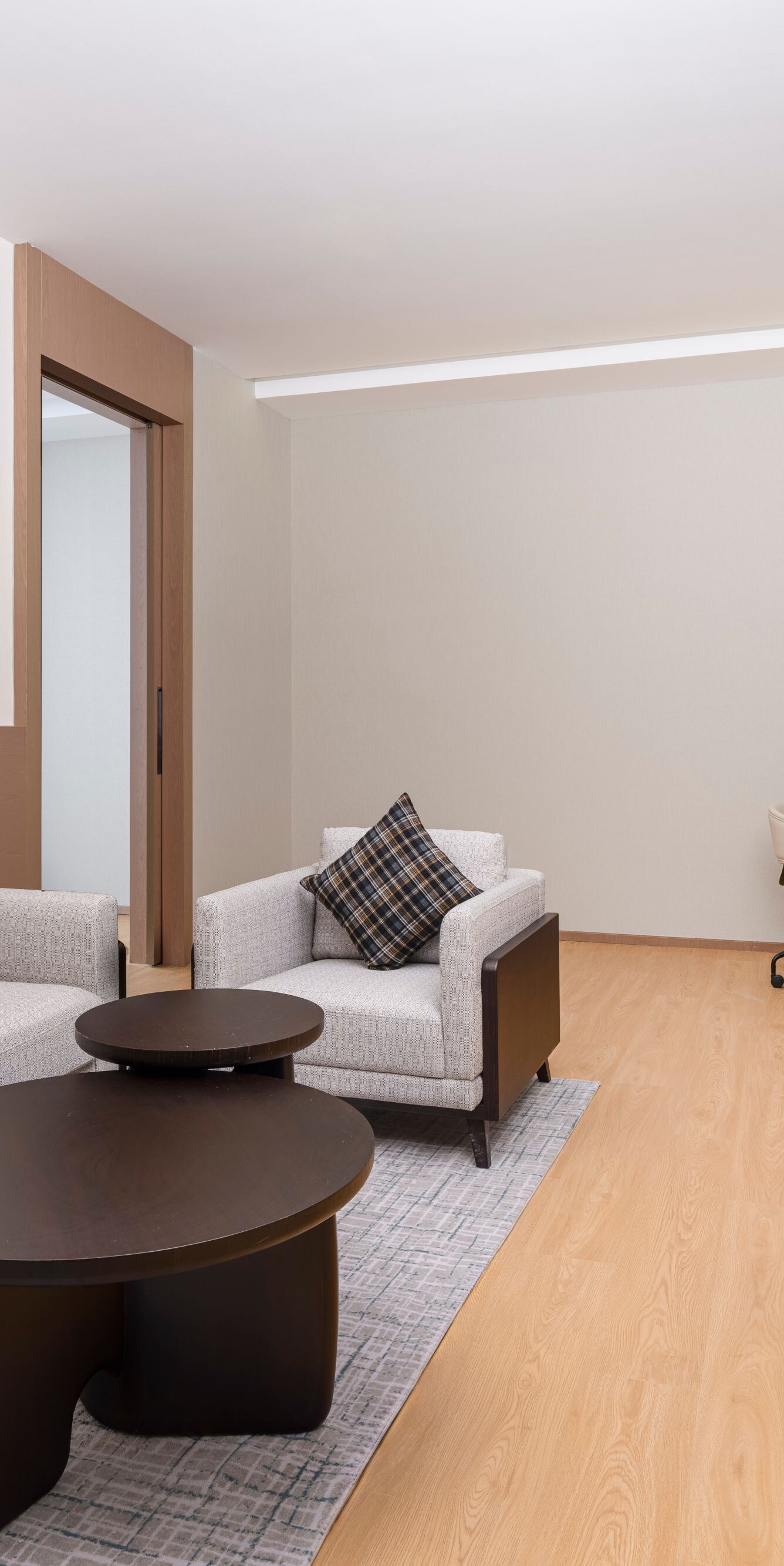 Spacious suite living room with sofa and work desk