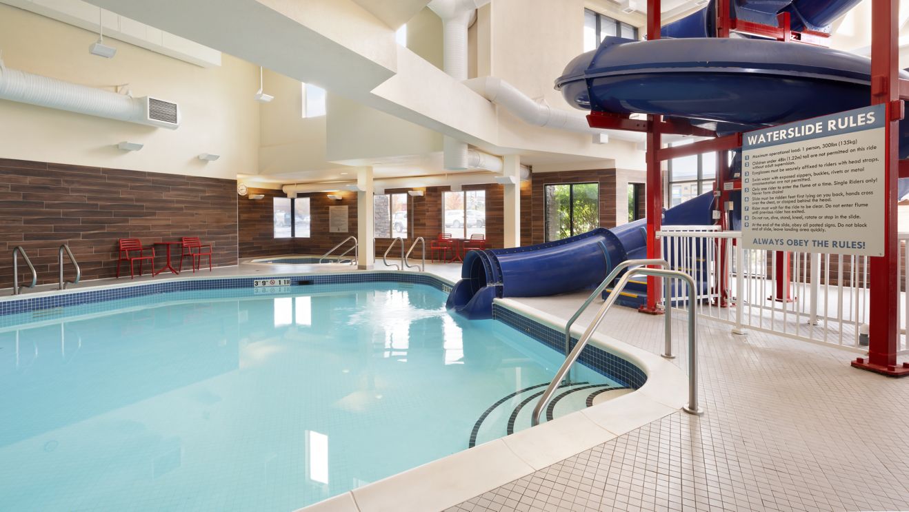Pool with waterslide and indoor hot tub