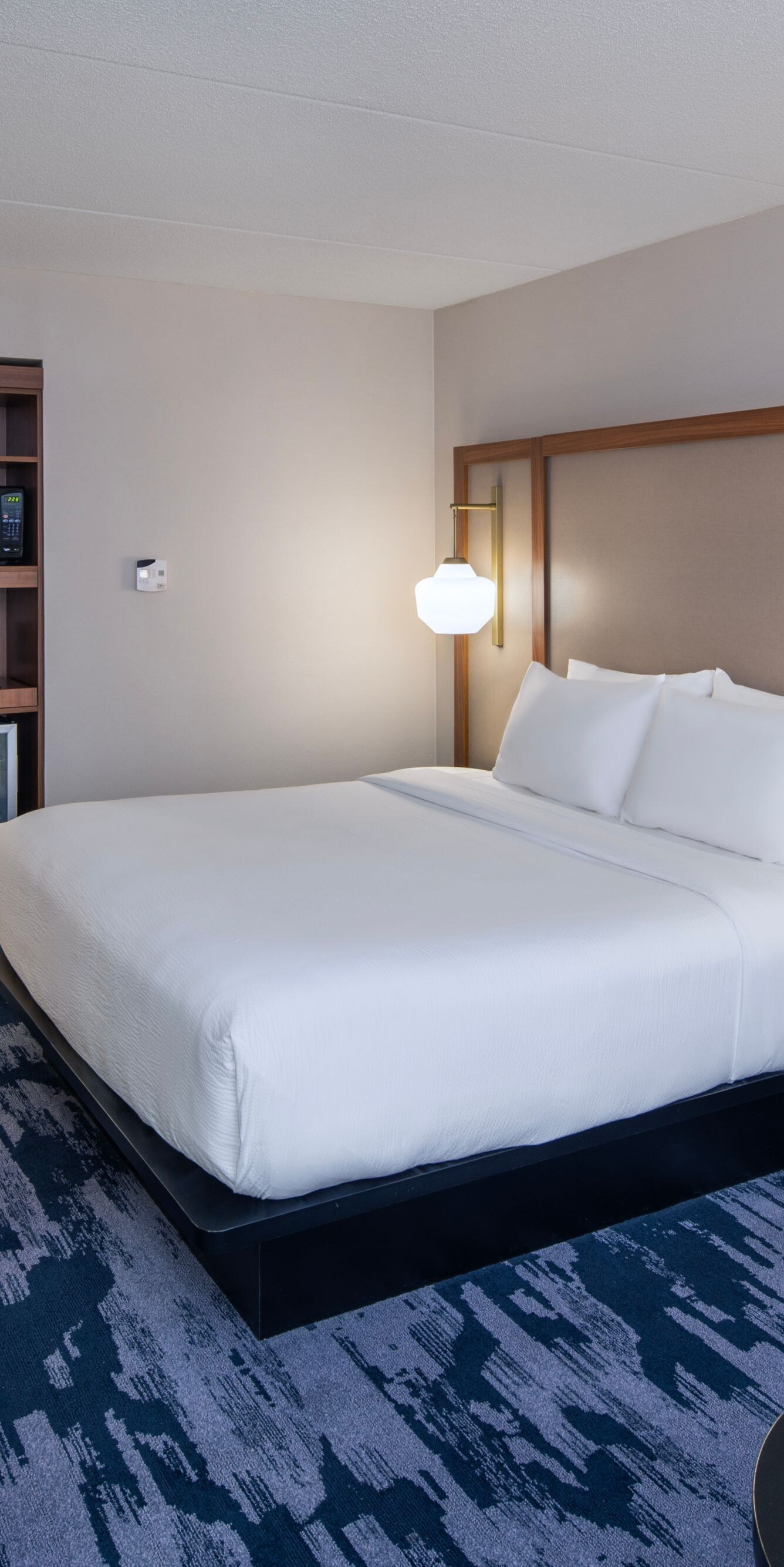 King guest room with desk and armchair