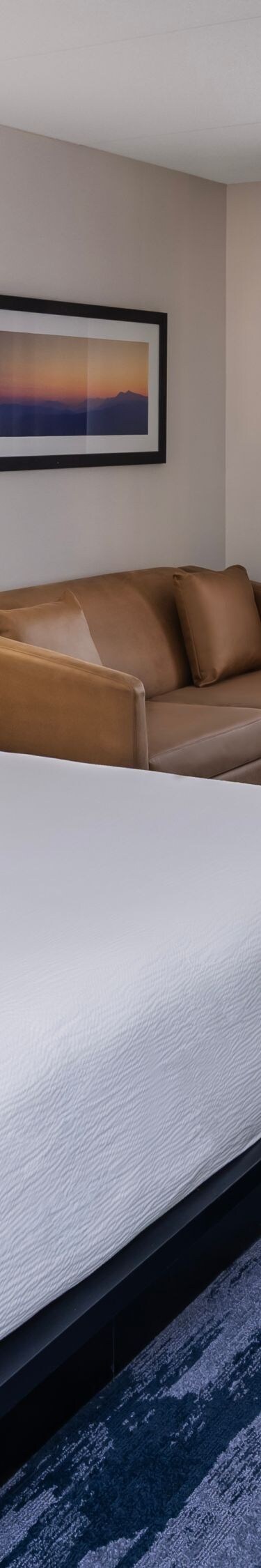 King guest room with sofa and work desk