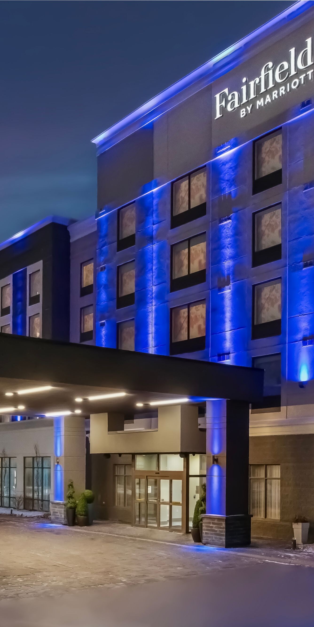 Exterior entrance with blue accent lighting