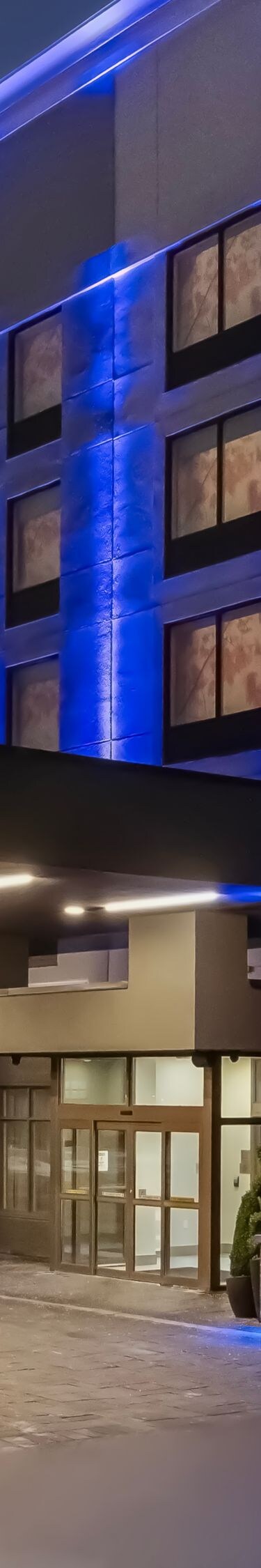 Exterior entrance with blue accent lighting
