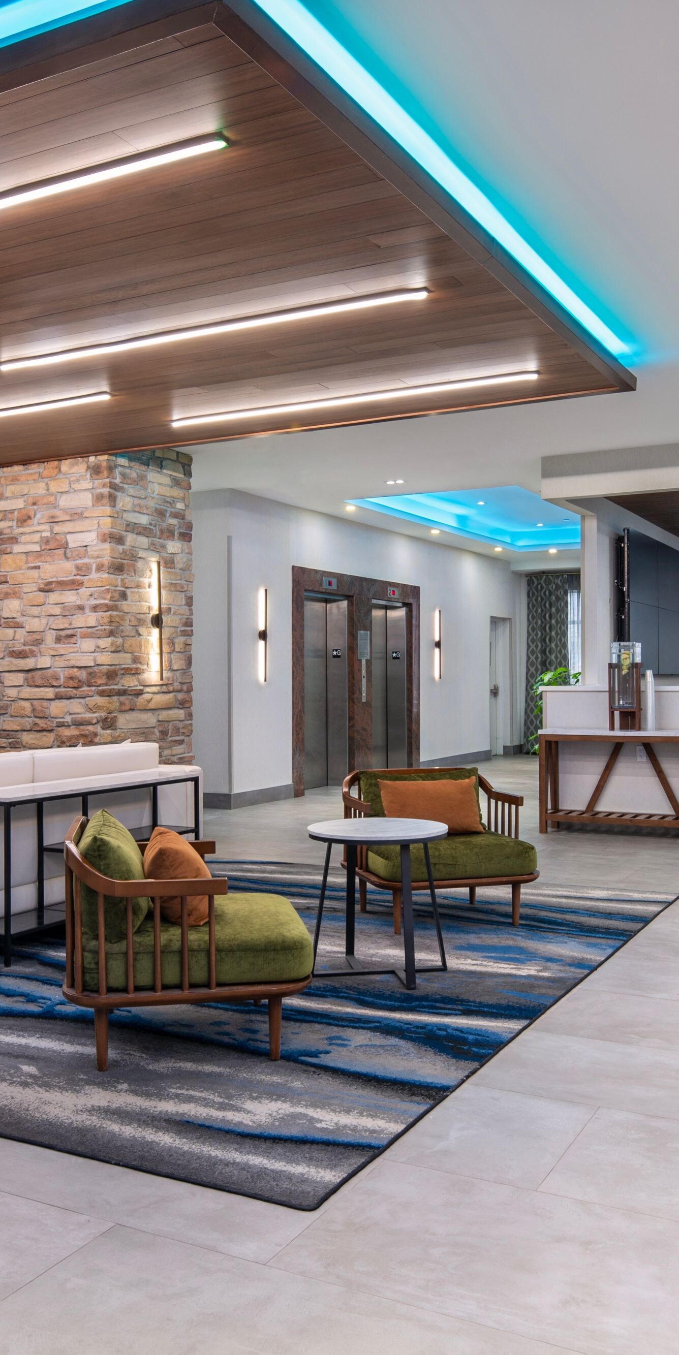 Lobby with stone wall and blue lighting