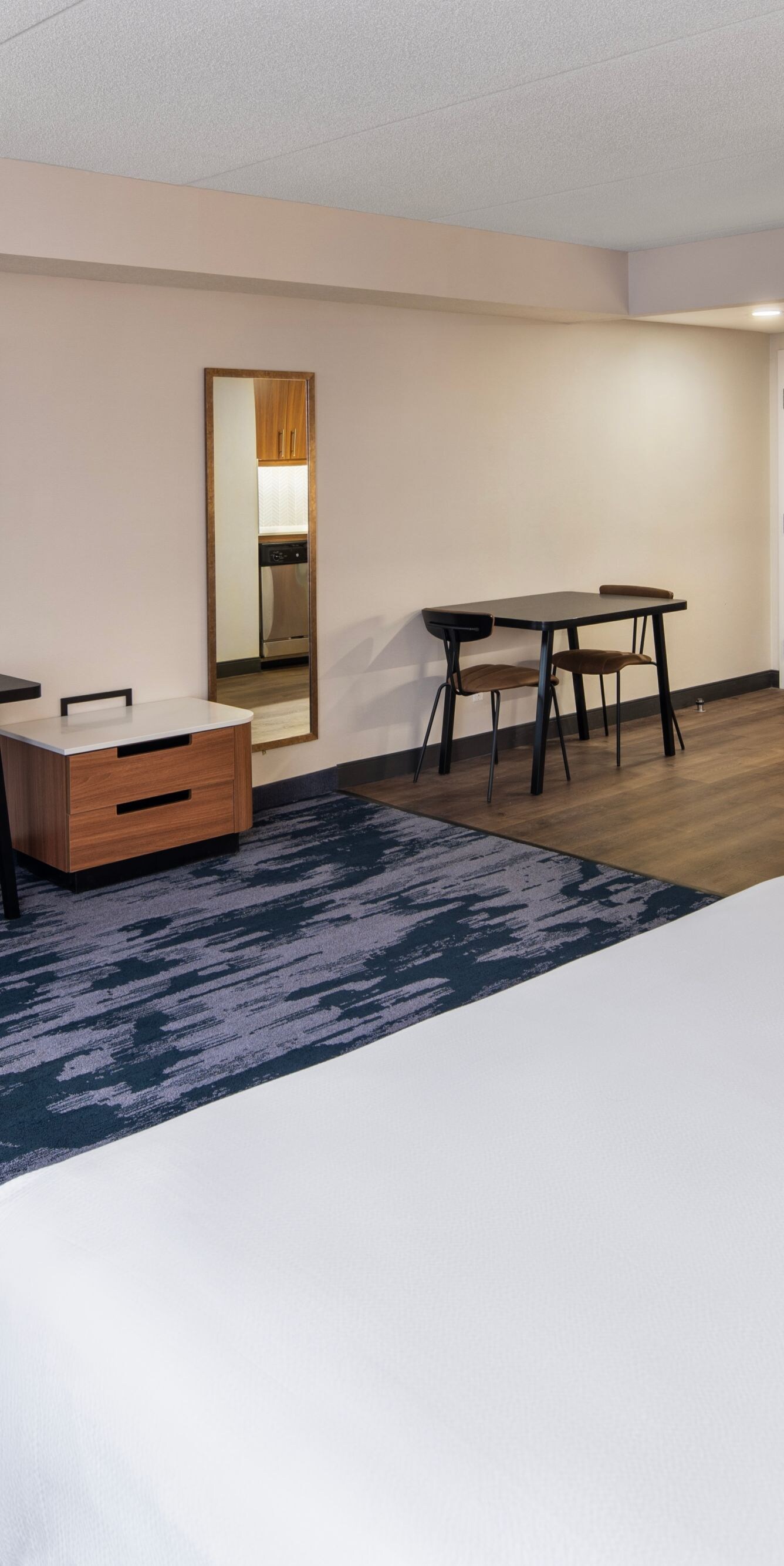 Guest room with king bed and workspace