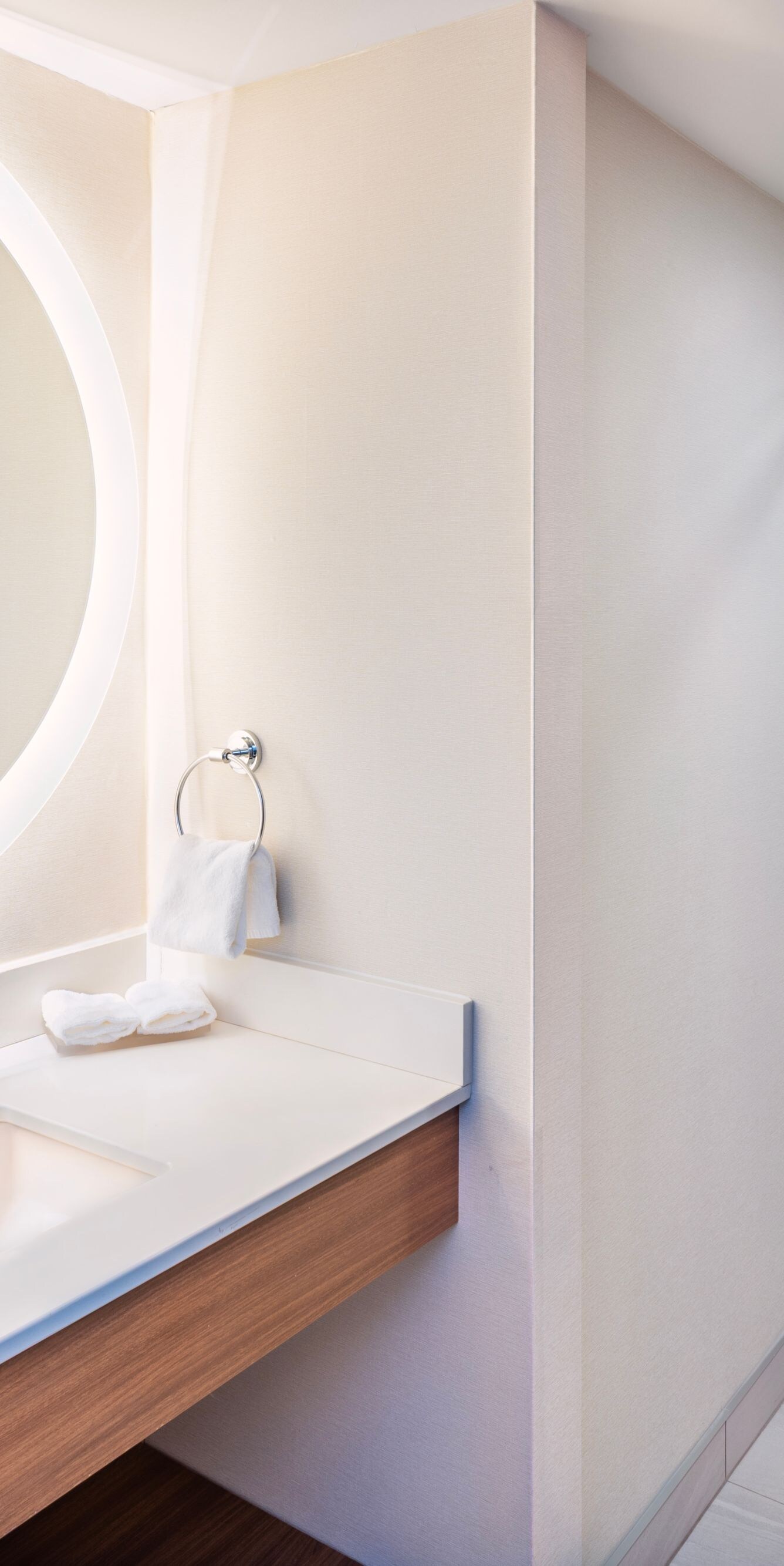 Modern bathroom with backlit mirror