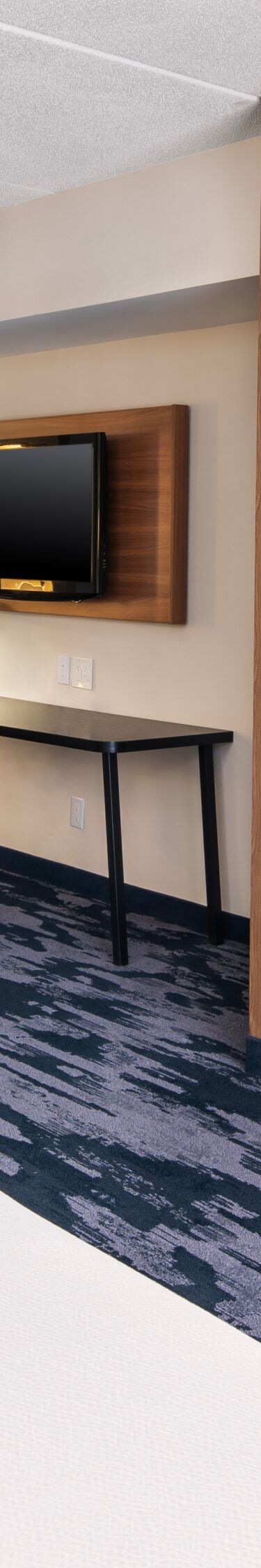 Guest room with work desk and kitchenette