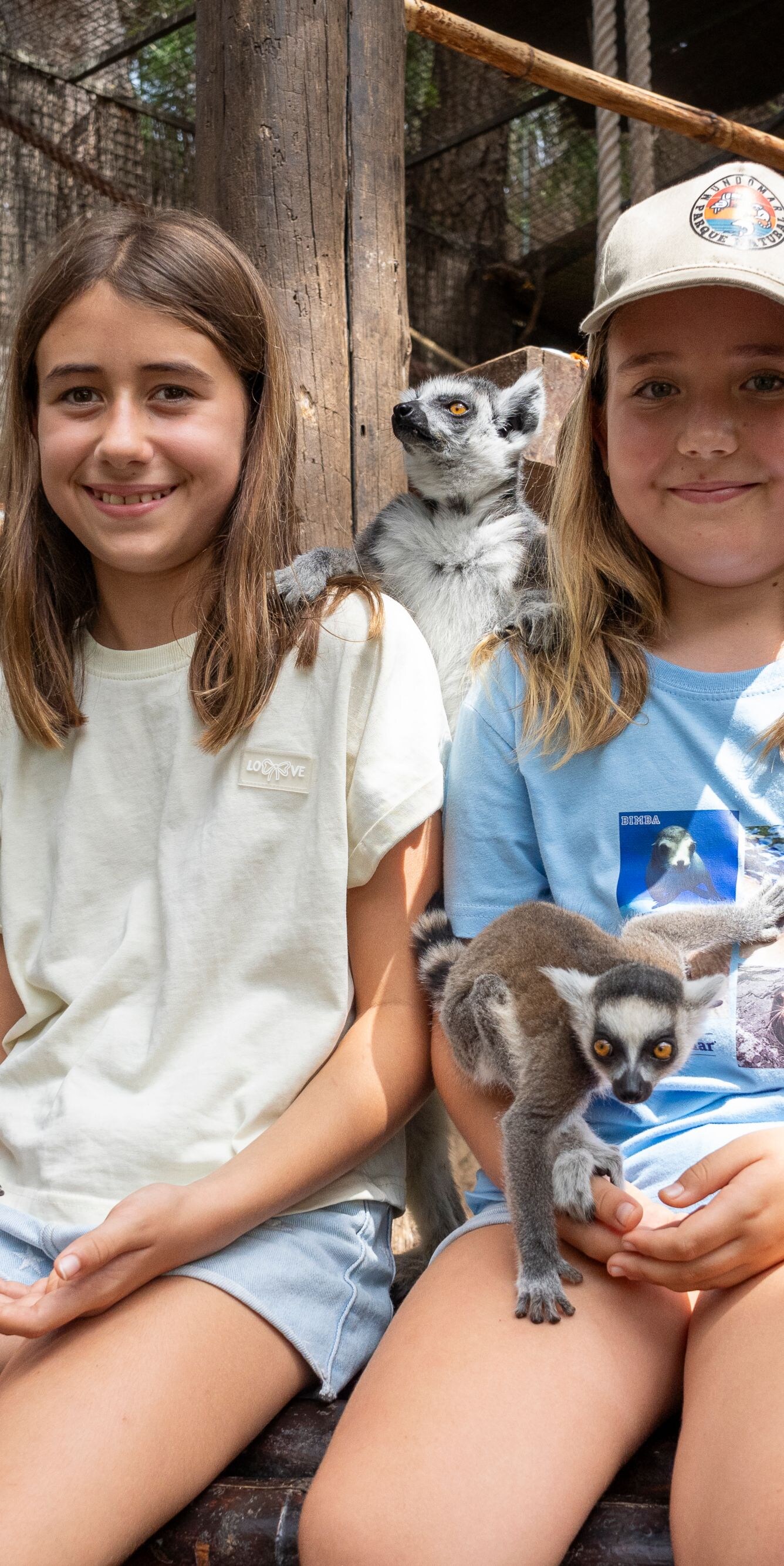 two children with lemurs