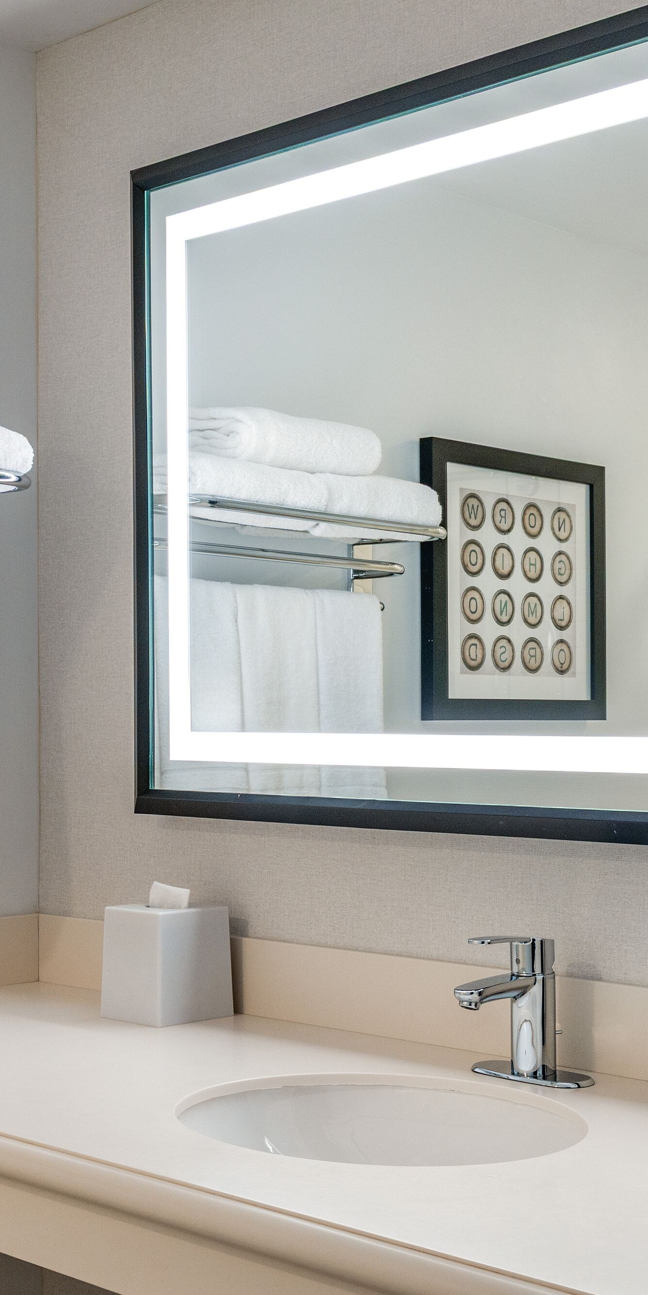 Bathroom vanity counter with sink and large mirror