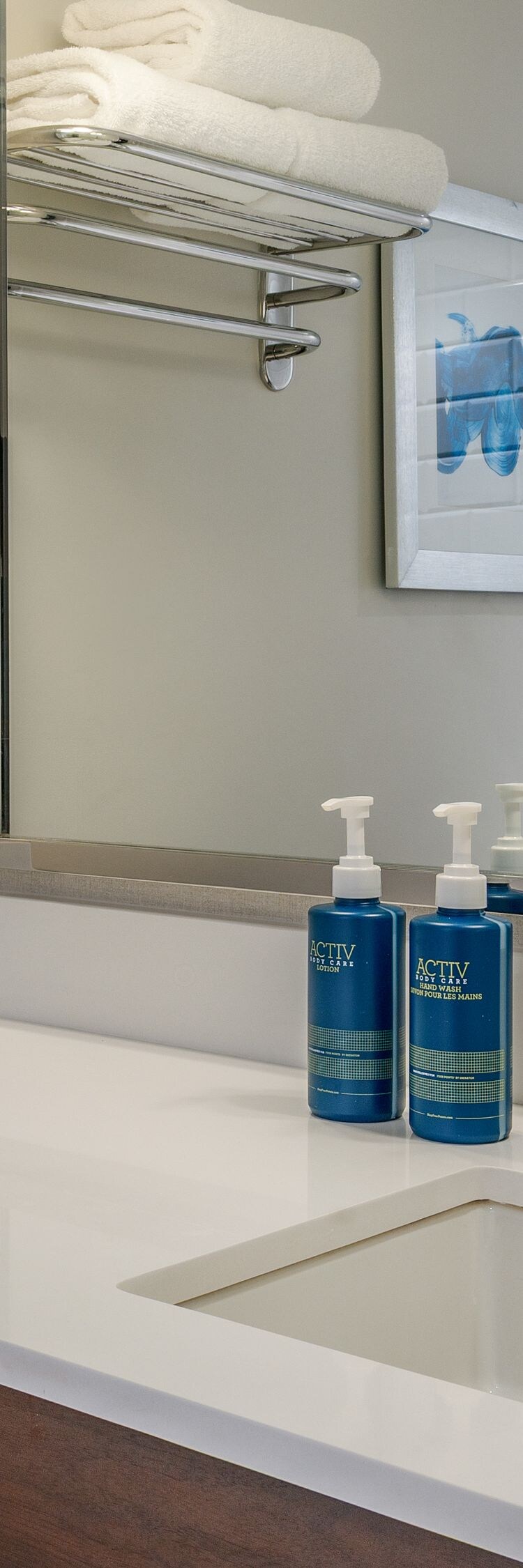 Standard guest bathroom with vanity and mirror 