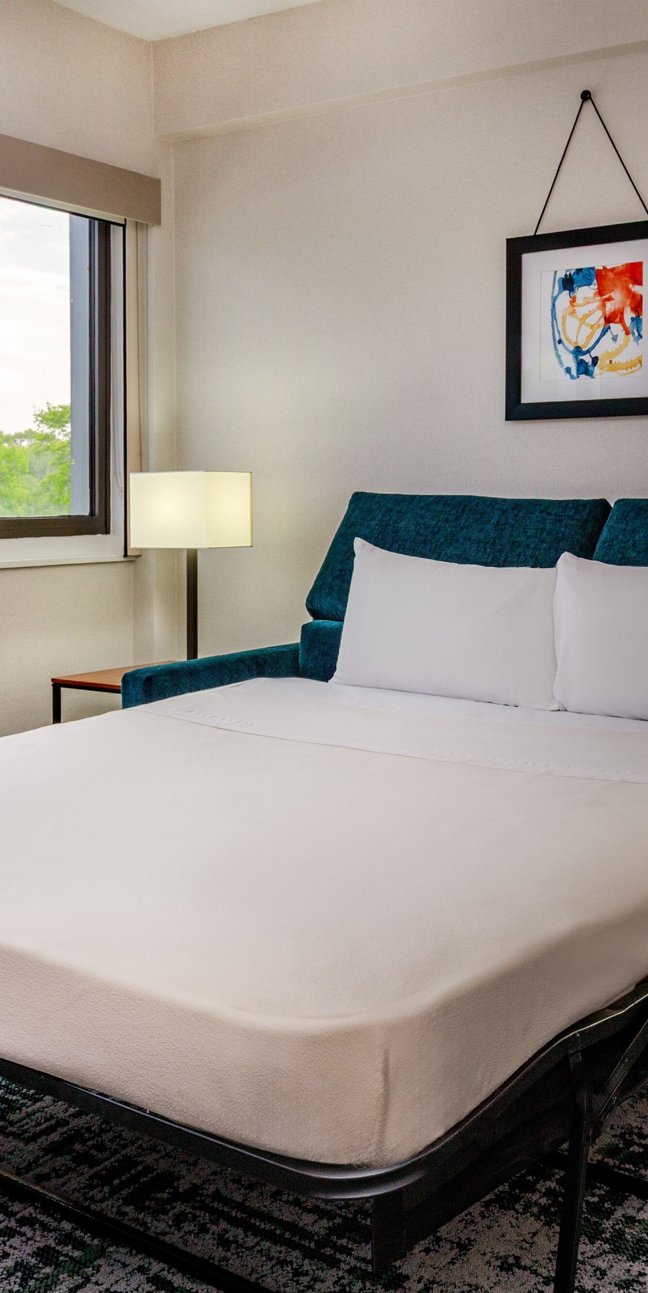 Sleeper sofa opened into a bed in a suite
