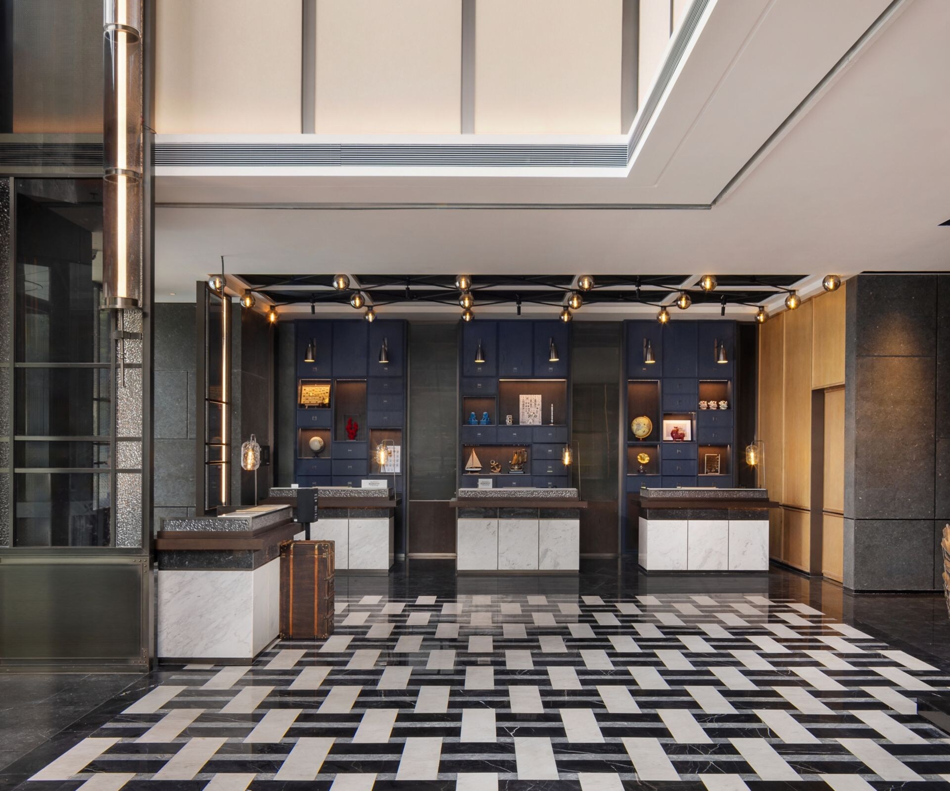 Hotel lobby with check-in counters and art wall