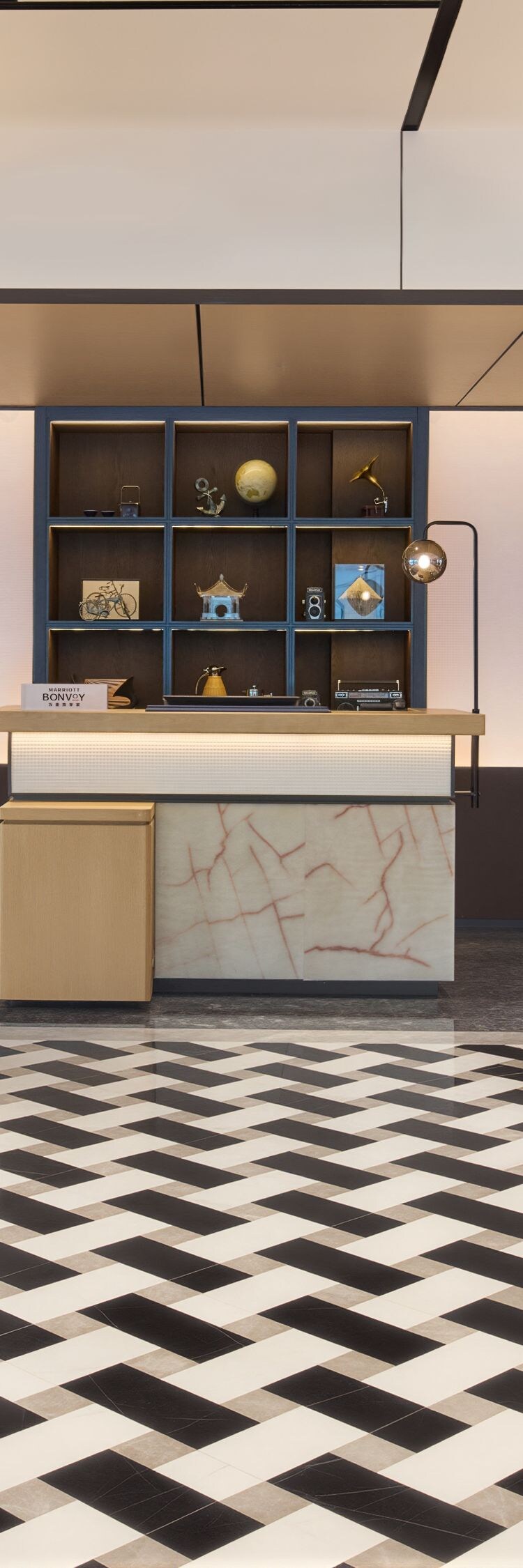 Reception desk with marble and blue shelving