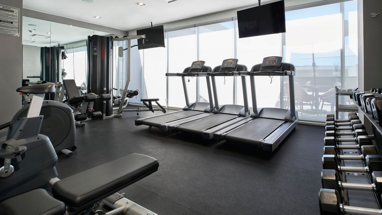 fitness center with cardio and strength equipment