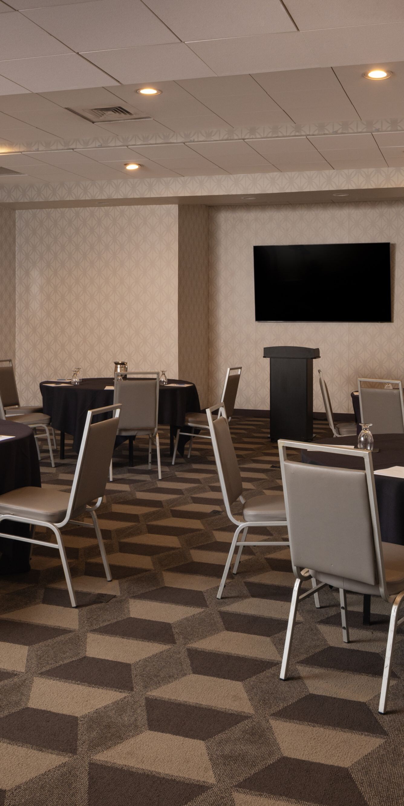 Madison banquet room with round tables and podium