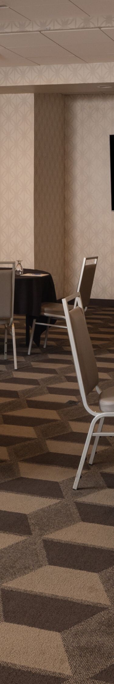 Madison banquet room with round tables and podium
