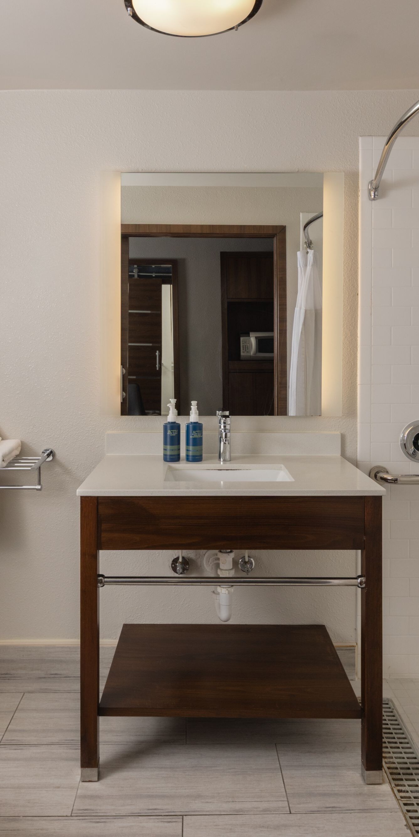 Guest room accessible bathroom with roll-in shower