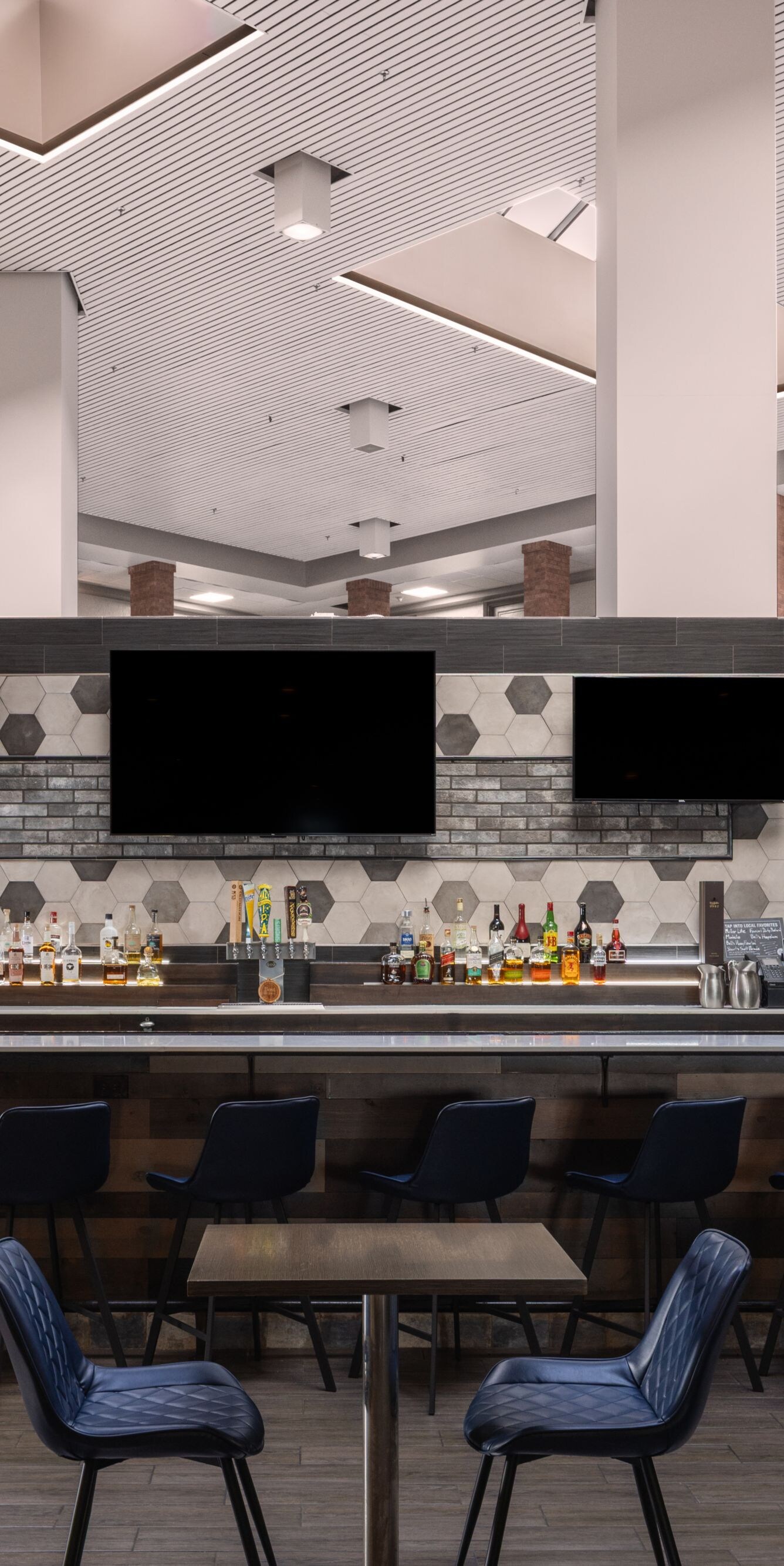 Lobby bar with bar seating and tables