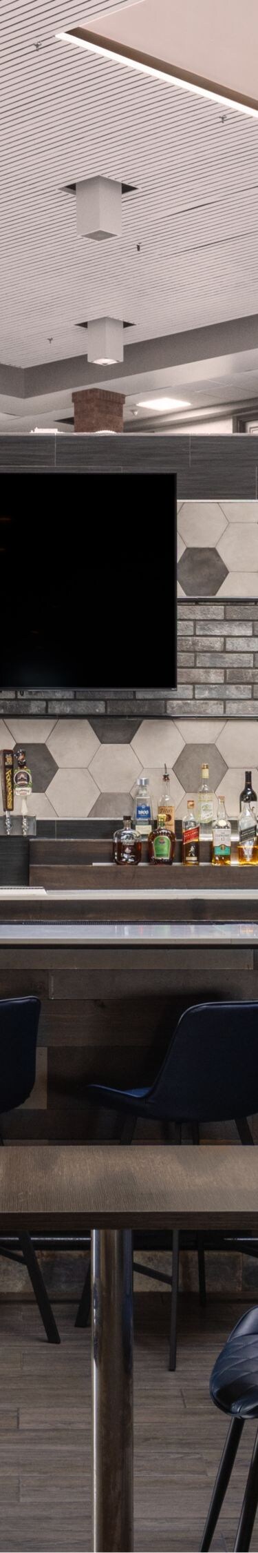 Lobby bar with bar seating and tables