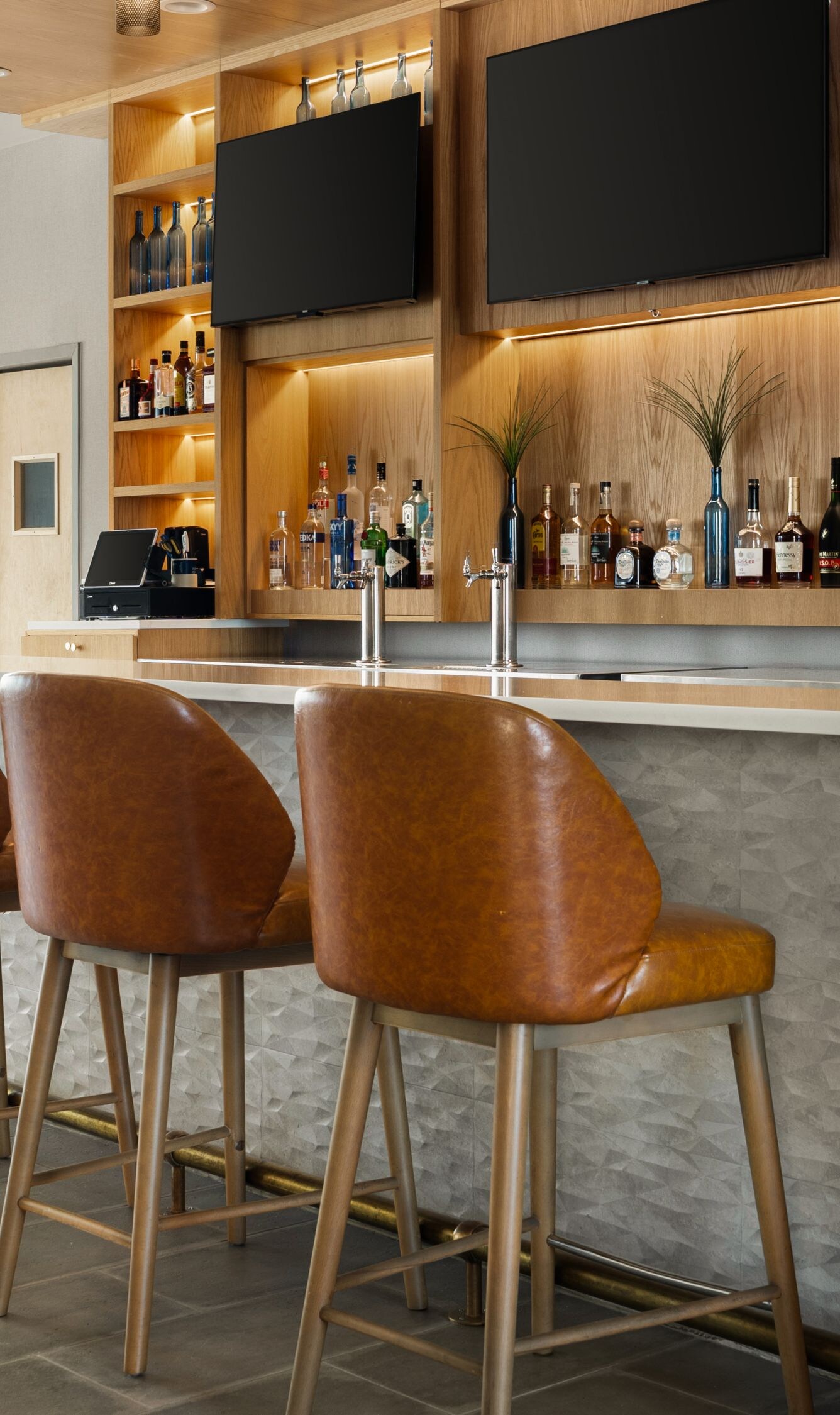 Modern bar with leather stools and views