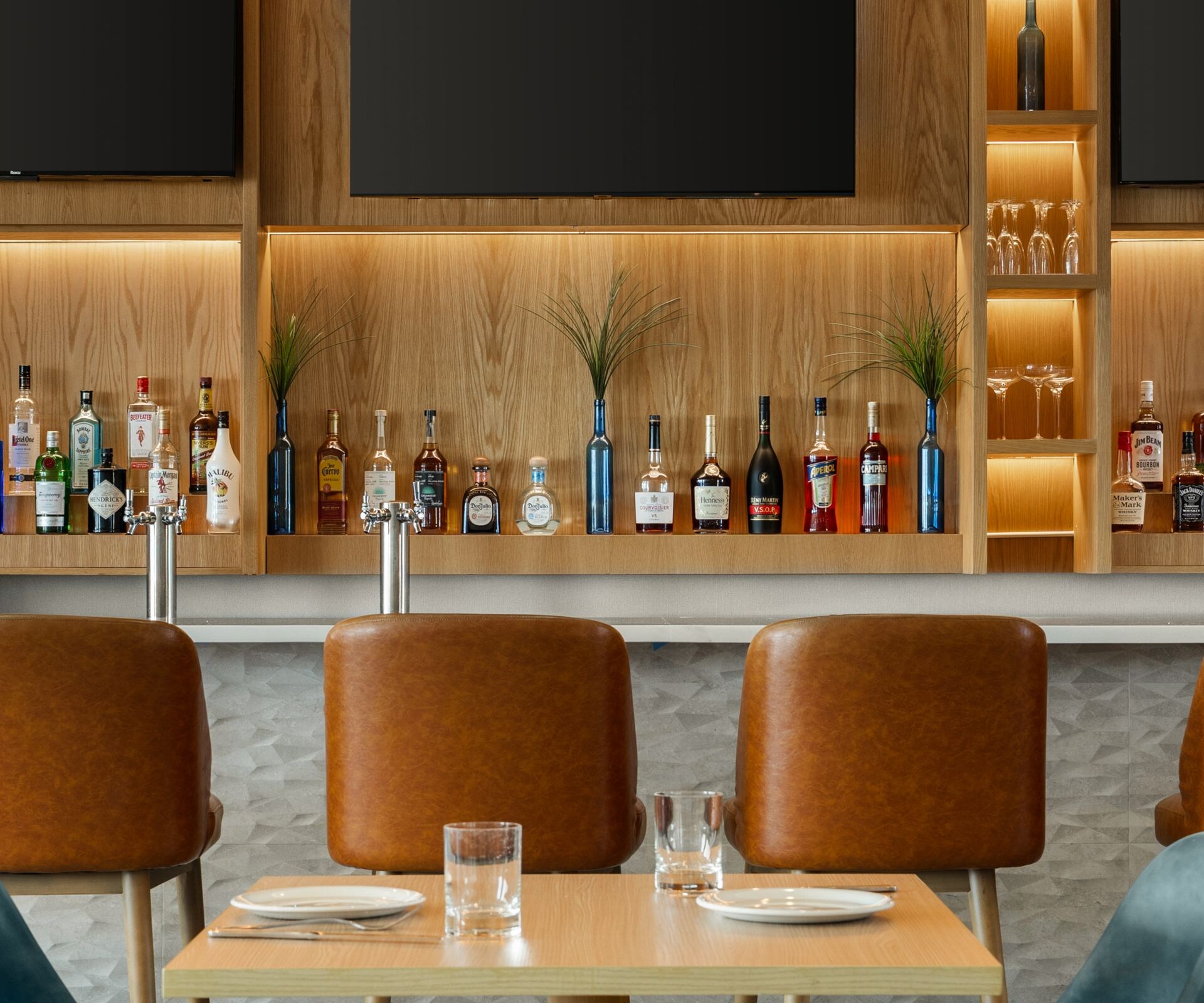 Modern bar with leather stools and seating